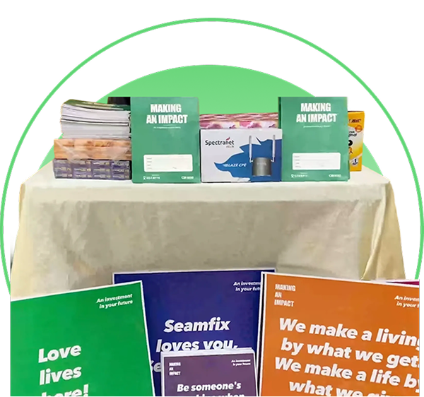 Seamfix "Making an Impact" books and placards prepared for a community school outreach